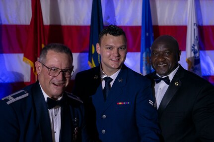 U.S. Air Force Col. Adam Willis (left) , Airman 1st Class Seth Grey (middle), and retired U.S. Army Command Sgt. Maj. Patrick Alston, ceremoniously cut the Air Force birthday cake aboard the USS YORKTOWN at Patriot’s Point, Mount Pleasant, South Carolina, Sept. 17, 2021.In Air Force tradition, the youngest and oldest Airmen in attendance cut the cake together to symbolize the heritage passing between two generations. (U.S. Air Force photo by Airman 1st Class Gage Rodriguez)