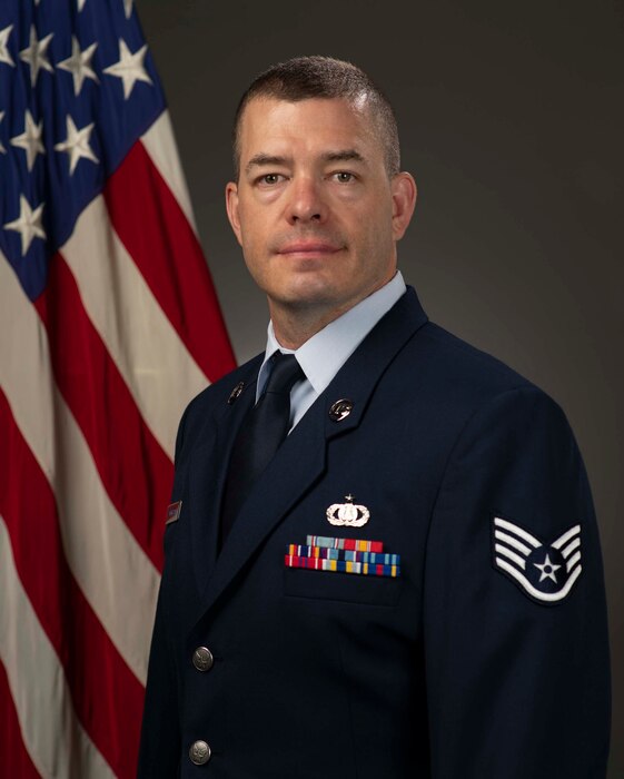 Official photo of A1C Jon Anderson, French Hornist with the Spirit of Freedom.