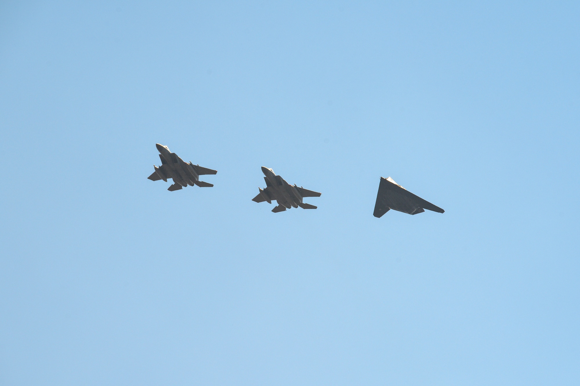 F-117 Nighthawks are accompanied by F-15 Eagles on the flightline of the 144th Fighter Wing located at the Fresno Air National Guard Base, Calif. Sept. 15, 2021.