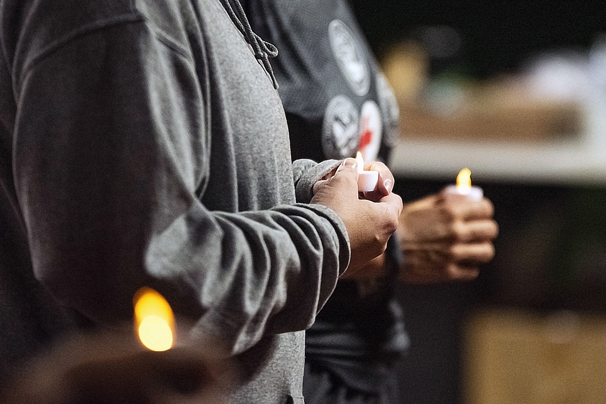 Participants hold candle lights for POW/MIA candle light vigil ceremony.