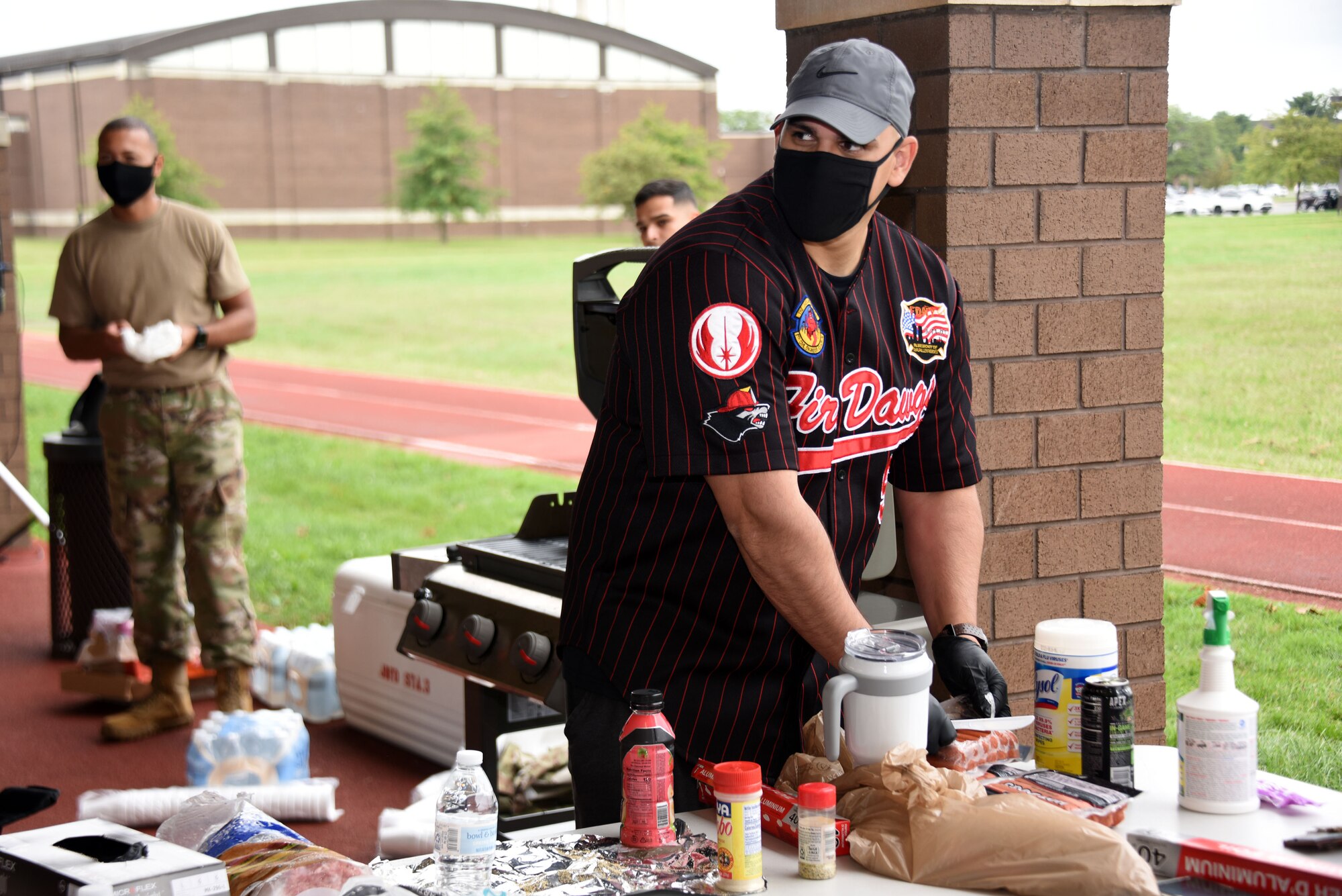 Airman sets up food and refreshments during the POW/MIA run or walk event.