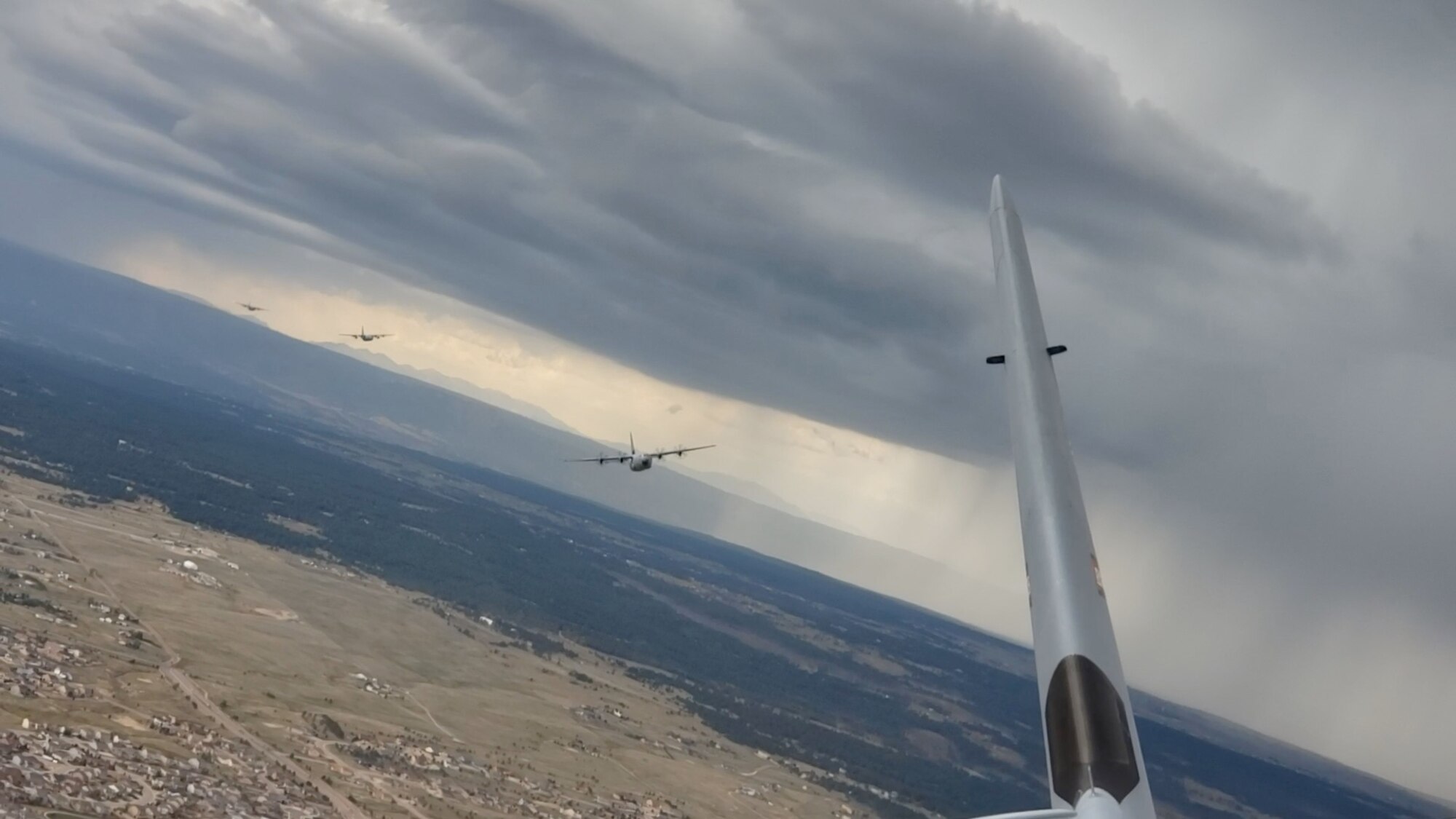 Members of the 815th Airlift Squadron out of Keesler Air Force Base, Miss. and the 757th Airlift Squadron out of Youngstown Air Reserve Station, Ohio fly in formation while conducting an airdrop at Taylor Park, Colorado during the 22nd Air Force’s flagship exercise Rally in the Rockies Sept. 13-17, 2021. The exercise is designed to develop Airmen for combat operations by challenging them with realistic scenarios that support a full spectrum of operations during military actions, operations or hostile environments. (U.S. Air Force photo by Master Sgt. Jessica Kendziorek)