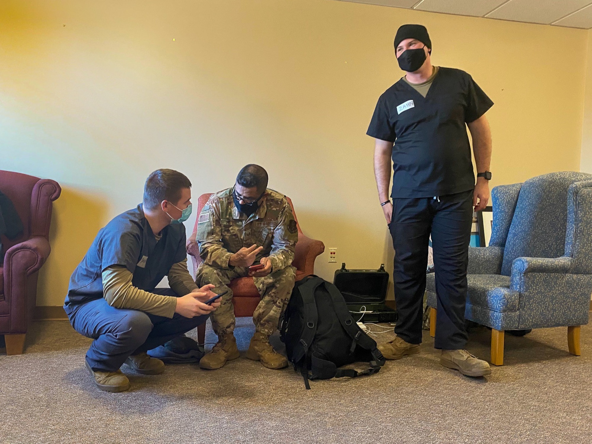 Tech Sgt. Gautambhai Patel, readiness non-commissioned officer in charge at the 128th Air Refueling Wing, discusses the plan for deploying the tactical field religious support kit at a coronavirus specimen collection site in Milwaukee, Wis. August 2020. Nearly 700 Citizen Soldiers and Airmen from the Wisconsin National Guard are currently serving in direct support of the state’s on-going response to COVID-19 in a variety of statuses. (Courtesy photo)