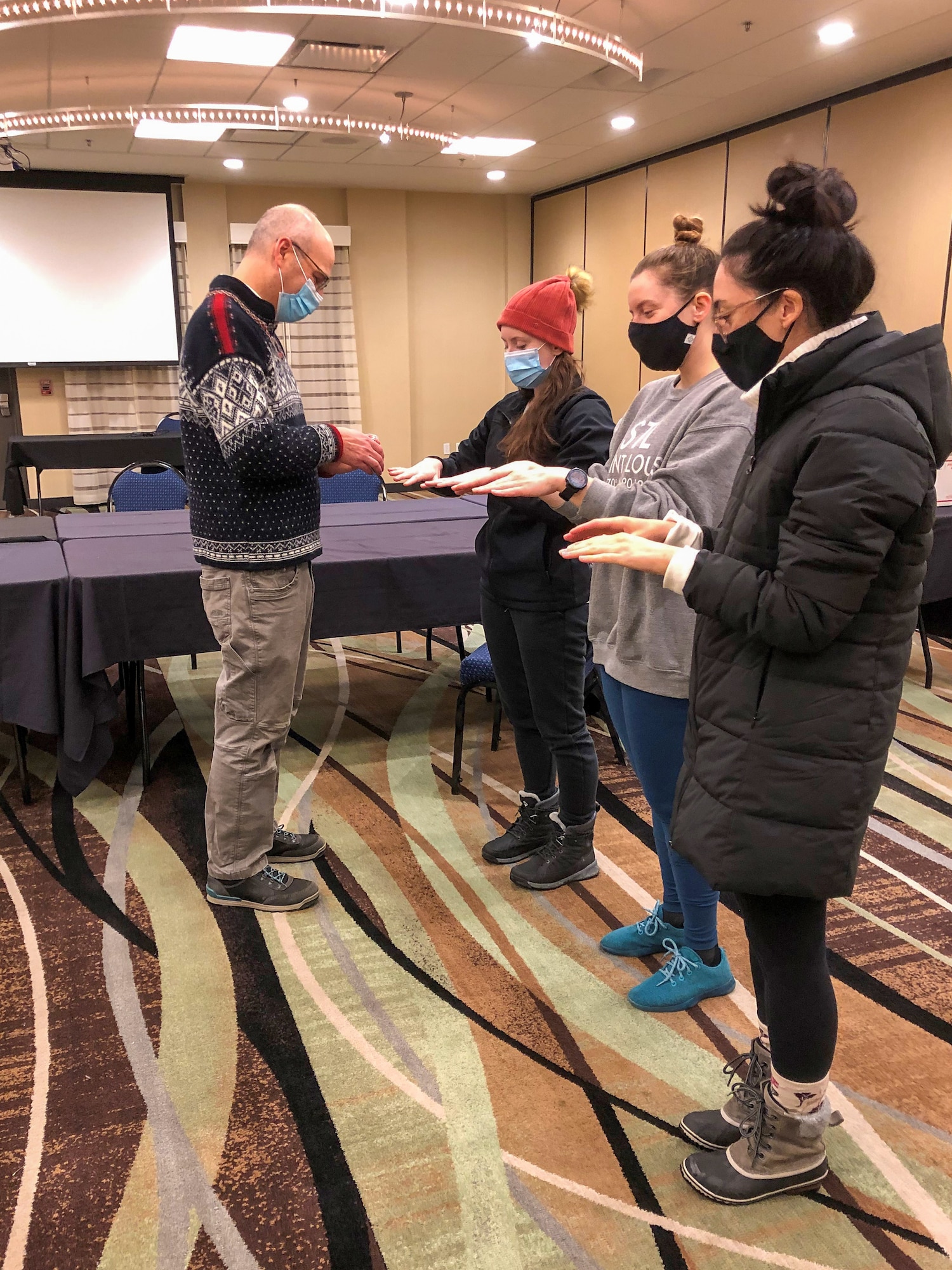 Maj. Philip Cunningham, a 128th ARW chaplain, conducts a Blessing of The Hands service for active duty Army nurses deployed to the Marshfield Clinic Hospital in Marshfield, Wis. Dec. 2020. Nearly 700 Citizen Soldiers and Airmen from the Wisconsin National Guard are currently serving in direct support of the state’s on-going response to COVID-19 in a variety of statuses. (Courtesy photo)