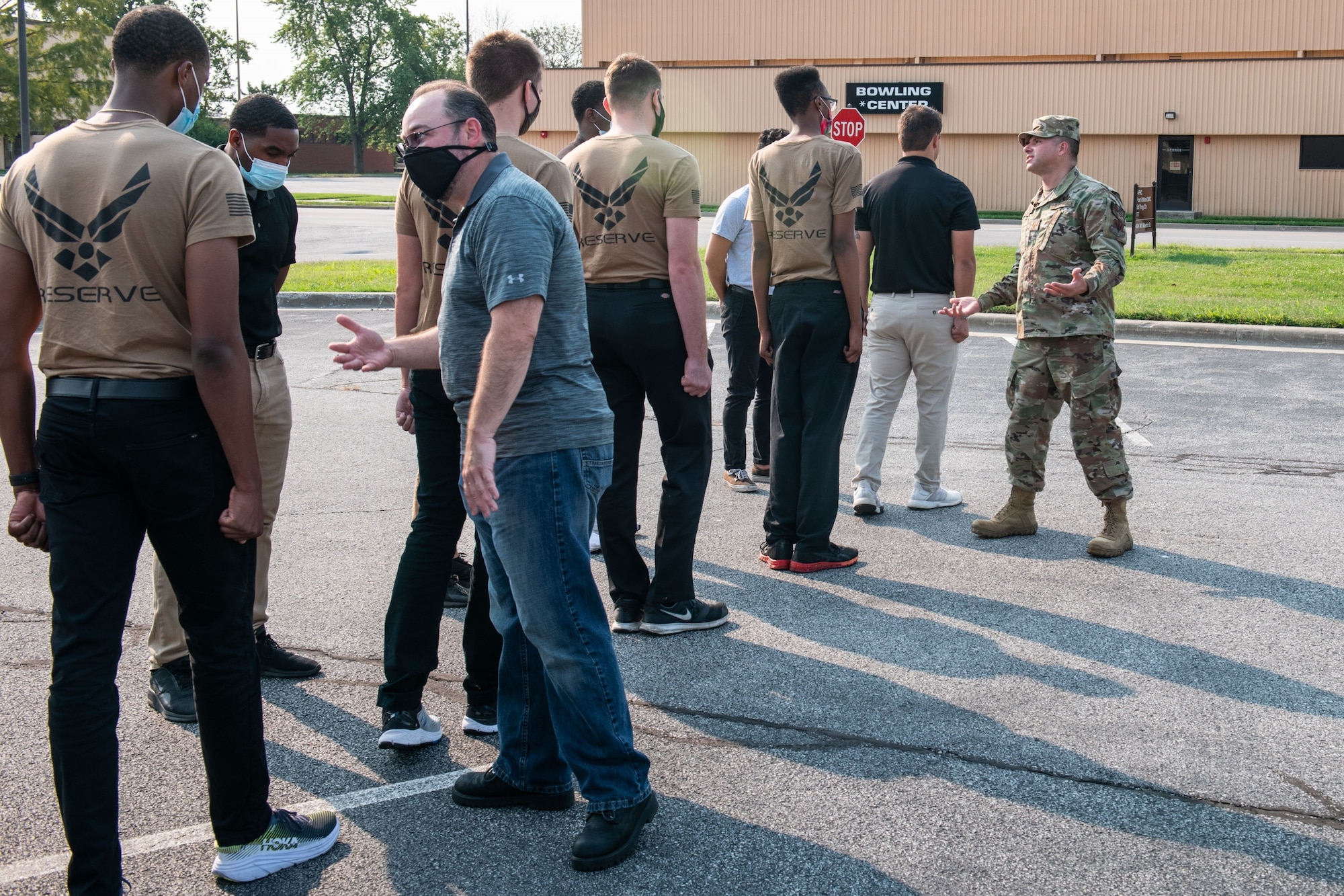 Mr. Dan Cooper, retired U.S. Air Force Master Sgt., and Master Sgt. Stravros Kalfoglou, 375th Communications Support Squadron, both previous training instructor, correct recruits drill movements, Scott Air Force Base, Illinois, Sept. 12, 2021. The D&TF teaches recruits knowledge learned in the first training week of basic military training (BMT), to help prepare and build confidence of recruits before they attend BMT. (U.S. Air Force Photo by Staff Sgt. Brooke Spenner)