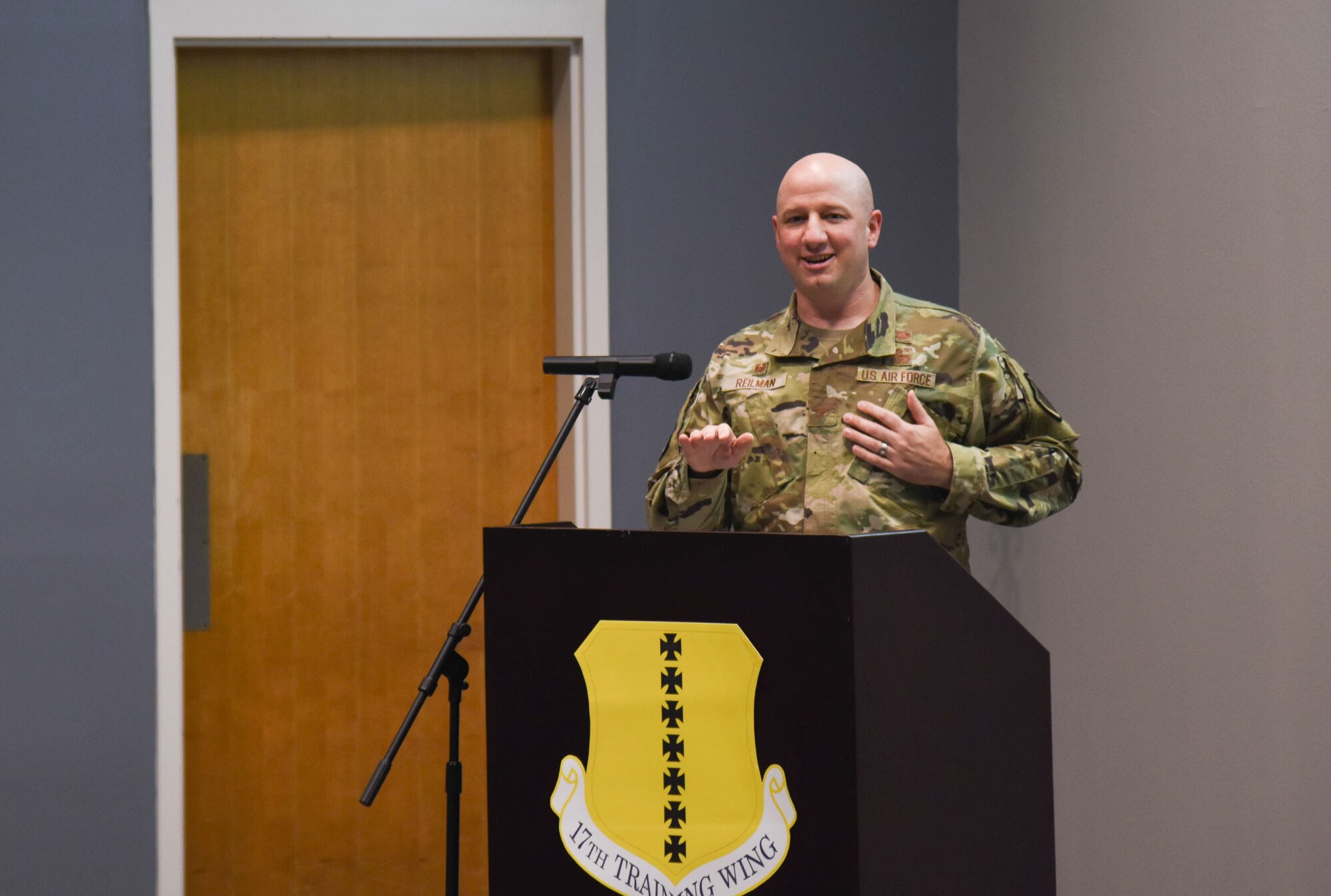 17th Training Wing commander Matthew Reilman speaks at an event