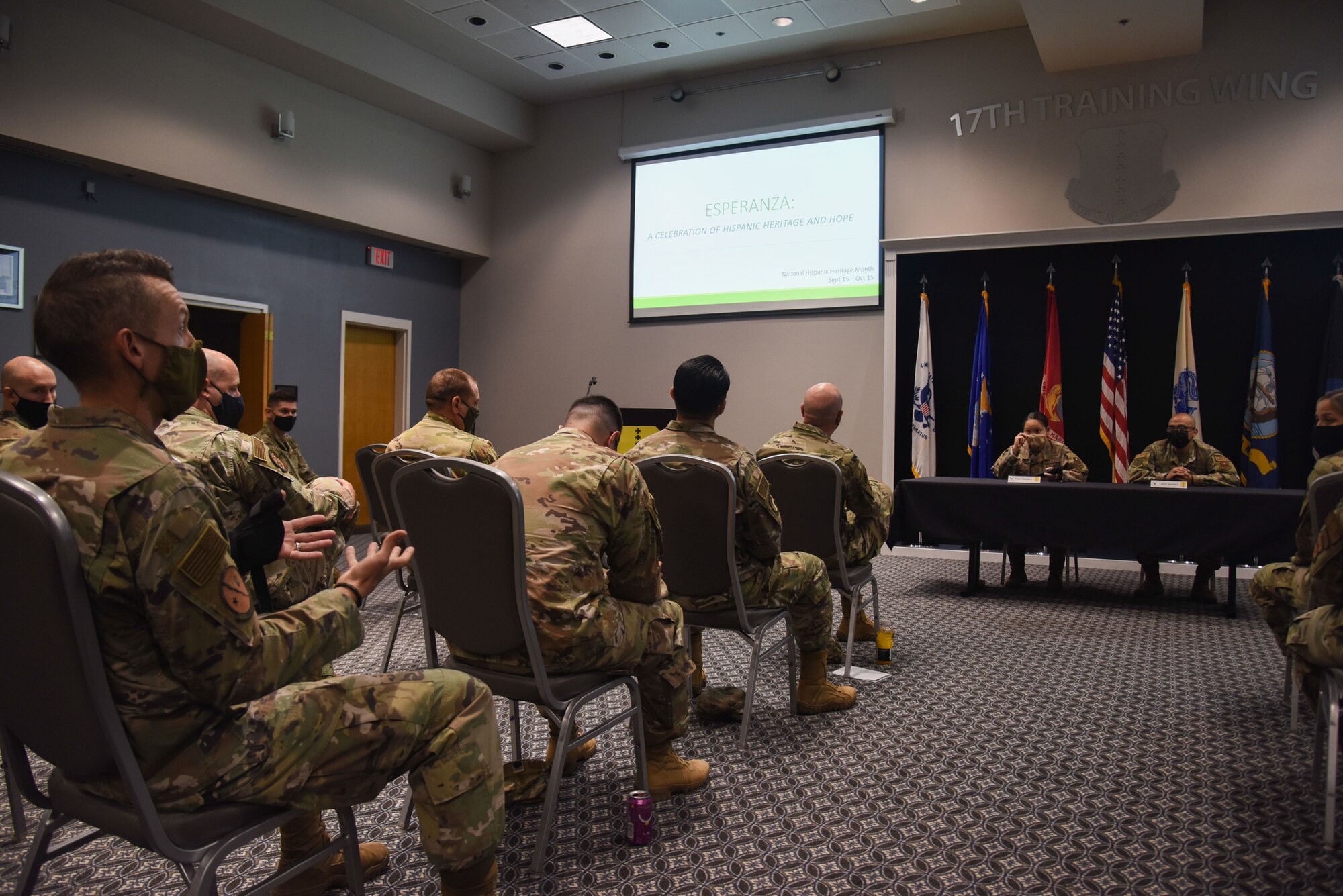 Air Force members ask questions to a Q&A panel during an event