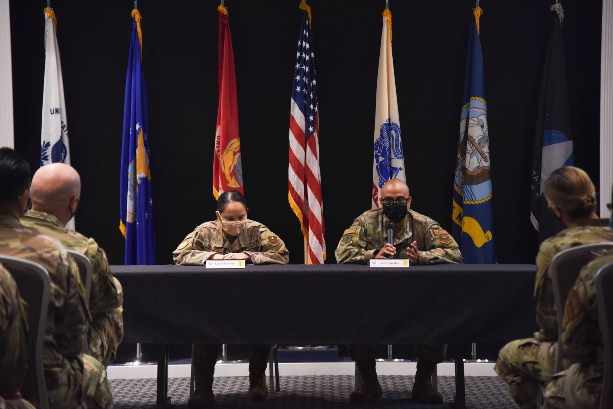Service members hold a Q&A panel