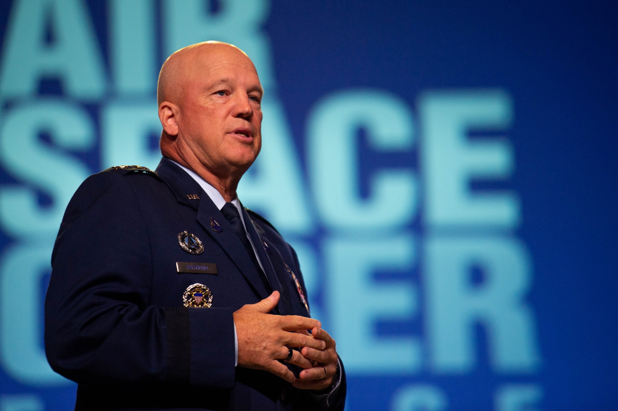 Chief of Space Force Operations Gen. John W. “Jay” Raymond gives an update on the U.S. Space Force during the Air Force Association Air, Space and Cyber Conference at National Harbor, Md., Sept. 21, 2021. During his presentation, Raymond previewed the Space Force’s Service Dress Prototype and gave insight to the “Guardian Ideals,” which identifies the Space Forces’s vision for its culture to ensure mission success. (U.S. Air Force photo by Tech. Sgt. Areca T. Wilson)