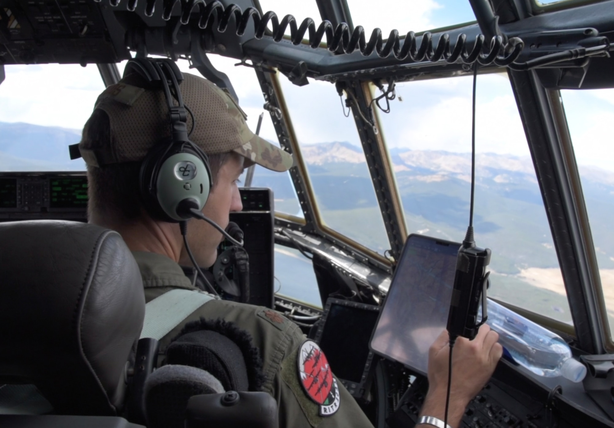 Maj. George Metros, 815th Airlift Squadron pilot, checks the navigation in preparation for landing at Vail Valley Jet Center, Gypsum, Colorado during the 22nd Air Force’s flagship exercise Rally in the Rockies Sept. 13-17, 2021. The exercise is designed to develop Airmen for combat operations by challenging them with realistic scenarios that support a full spectrum of operations during military actions, operations or hostile environments. (U.S. Air Force photo by Master Sgt. Jessica Kendziorek)