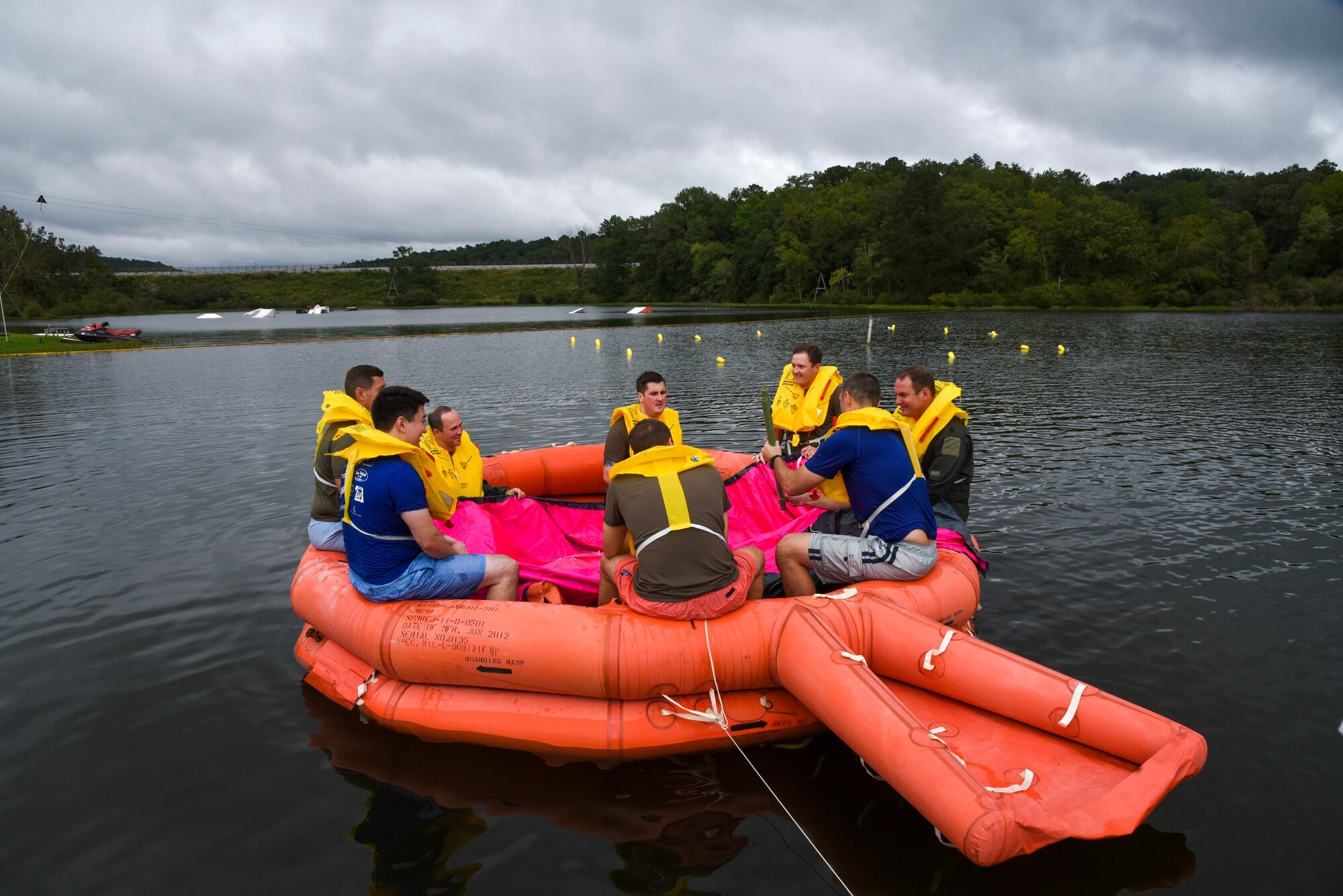 Airmen prepare for water survival training.