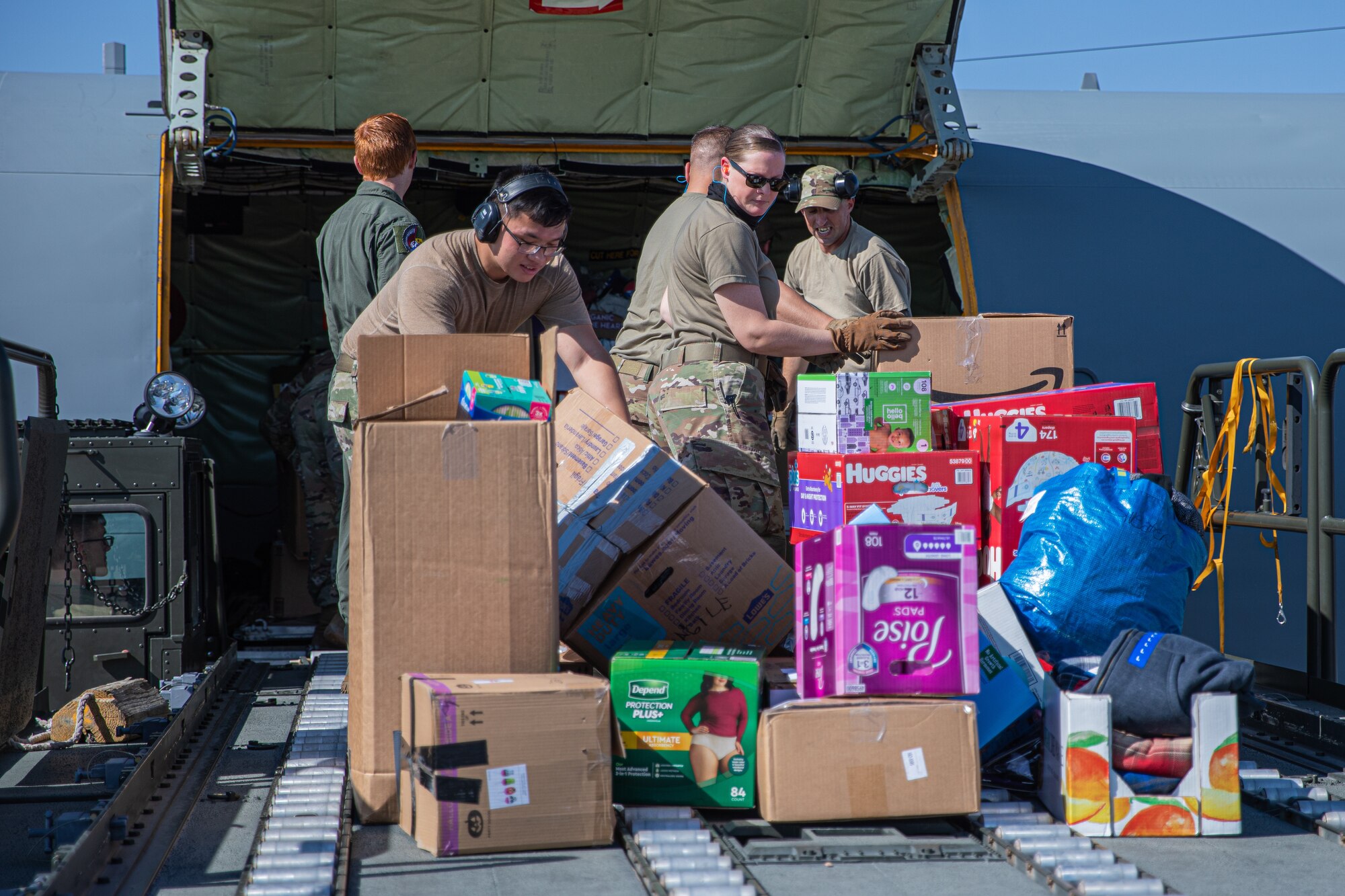 Airmen from Fairchild Air Force Base, Washington, unload donations off a KC-135 Stratotanker in support of Operation Allies Welcome on Holloman Air Force Base, New Mexico, Sept. 17, 2021. The Department of Defense, through U.S. Northern Command, and in support of the Department of State and Department of Homeland Security, is providing transportation, temporary housing, medical screening, and general support for at least 50,000 Afghan evacuees at suitable facilities, in permanent or temporary structures, as quickly as possible. This initiative provides Afghan evacuees essential support at secure locations outside Afghanistan. (U.S. Army photo by Pfc. Anthony Sanchez)