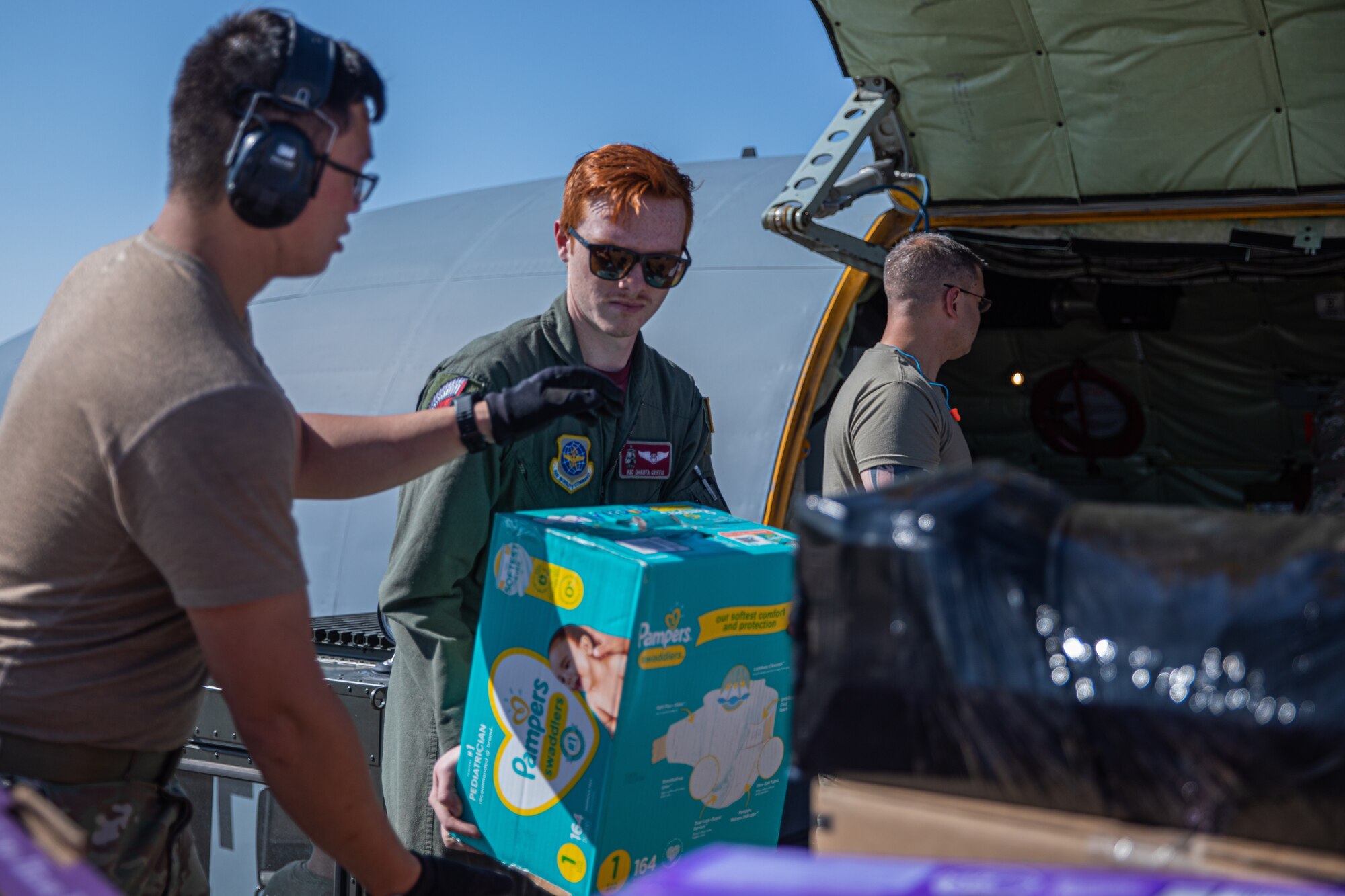 Airmen from Fairchild Air Force Base, Washington, unload donations off a KC-135 Stratotanker in support of Operation Allies Welcome on Holloman Air Force Base, New Mexico, Sept. 17, 2021. The Department of Defense, through U.S. Northern Command, and in support of the Department of State and Department of Homeland Security, is providing transportation, temporary housing, medical screening, and general support for at least 50,000 Afghan evacuees at suitable facilities, in permanent or temporary structures, as quickly as possible. This initiative provides Afghan evacuees essential support at secure locations outside Afghanistan. (U.S. Army photo by Pfc. Anthony Sanchez)