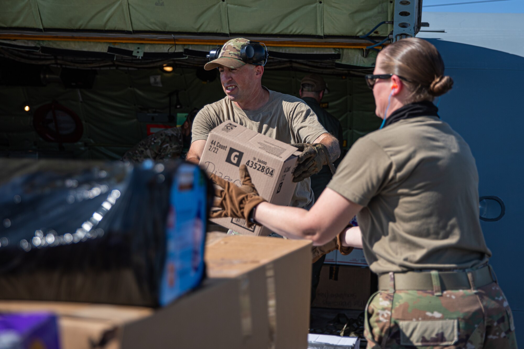Airmen from Fairchild Air Force Base, Washington, unload donations off a KC-135 Stratotanker in support of Operation Allies Welcome on Holloman Air Force Base, New Mexico, Sept. 17, 2021. The Department of Defense, through U.S. Northern Command, and in support of the Department of State and Department of Homeland Security, is providing transportation, temporary housing, medical screening, and general support for at least 50,000 Afghan evacuees at suitable facilities, in permanent or temporary structures, as quickly as possible. This initiative provides Afghan evacuees essential support at secure locations outside Afghanistan. (U.S. Army photo by Pfc. Anthony Sanchez)