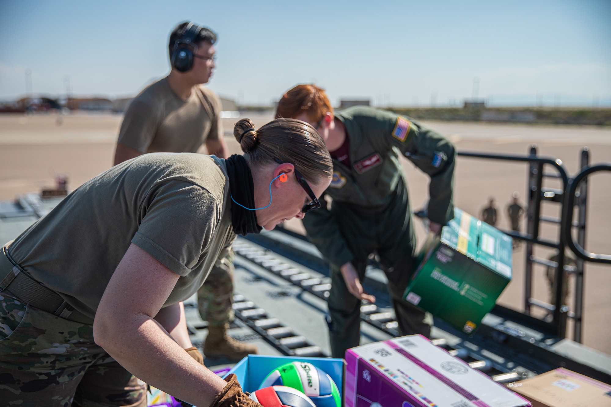 Airmen from Fairchild Air Force Base, Washington, unload donations off a KC-135 Stratotanker in support of Operation Allies Welcome on Holloman Air Force Base, New Mexico, Sept. 17, 2021.The Department of Defense, through U.S. Northern Command, and in support of the Department of State and Department of Homeland Security, is providing transportation, temporary housing, medical screening, and general support for at least 50,000 Afghan evacuees at suitable facilities, in permanent or temporary structures, as quickly as possible. This initiative provides Afghan evacuees essential support at secure locations outside Afghanistan. (U.S. Army photo by Pfc. Anthony Sanchez)