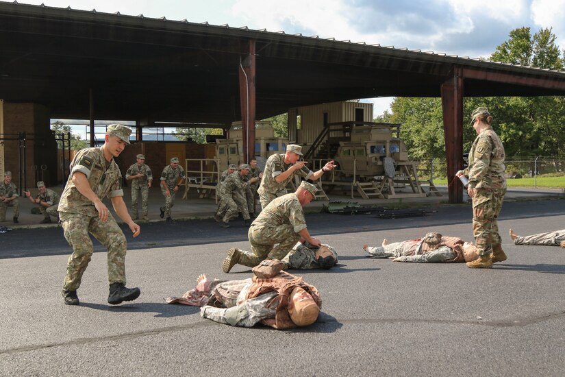 Lithuanian Soldiers rush to treat simulated casualties Sept. 10 at the Medical Battalion Training Site (MBTS) at Fort Indiantown Gap, Pa. Thirty-three Soldiers from Lithuania’s land forces reserve component came to Fort Indiantown Gap Sept. 6-17 for an annual platoon exchange, part of the Pennsylvania National Guard’s State Partnership Program.