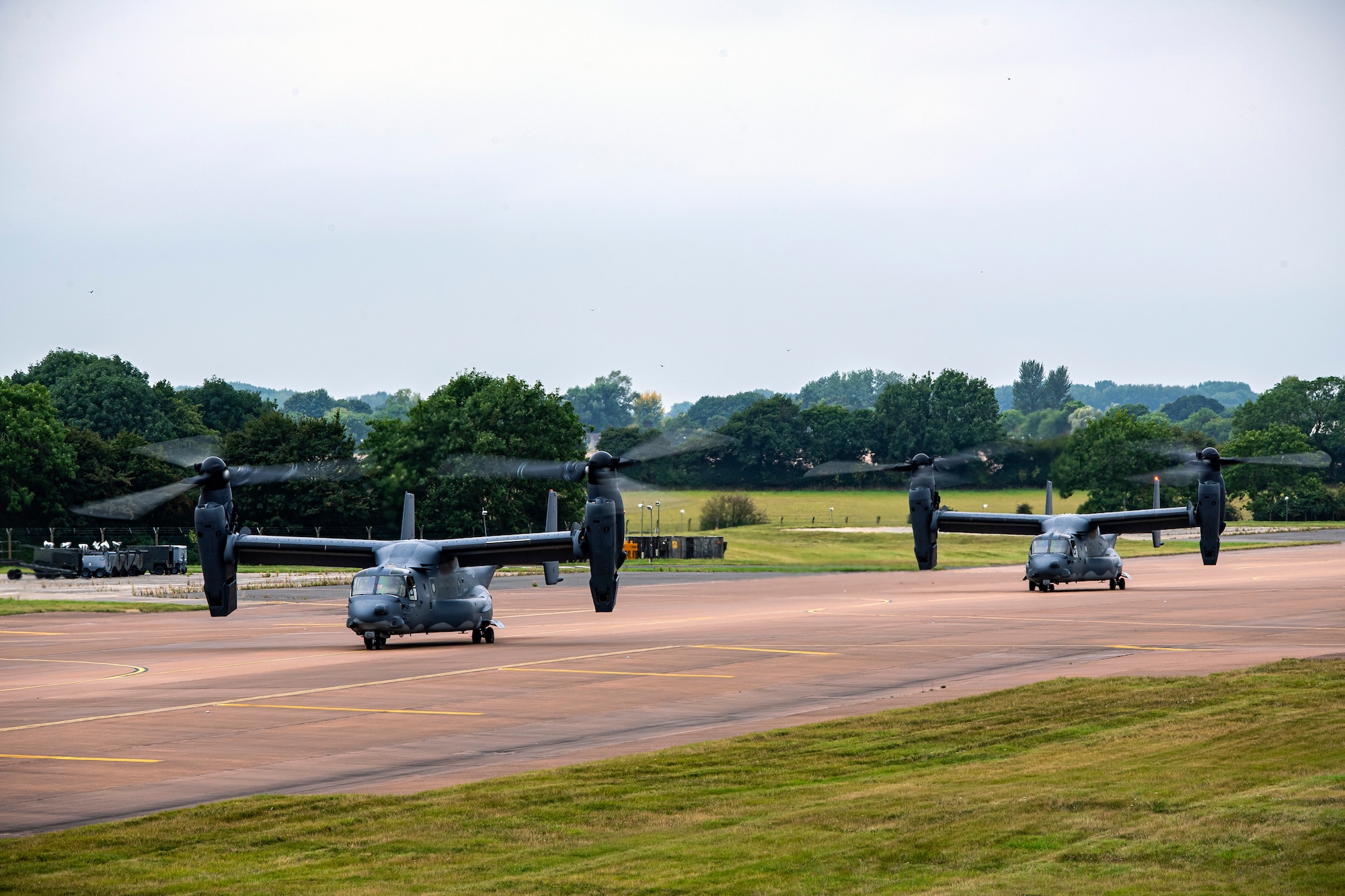 Two CV-22A Ospreys assigned to the 352d Special Operations Wing taxi on the flightline during an Agile Combat Employment exercise at RAF Fairford, England, Sept. 13, 2021. The exercise enables U.S. forces in Europe to operate from locations with varying levels of capacity and support. This further ensures Airmen and aircrews are postured to deliver lethal combat power across the full spectrum of military operations. (U.S. Air Force photo by Senior Airman Eugene Oliver)