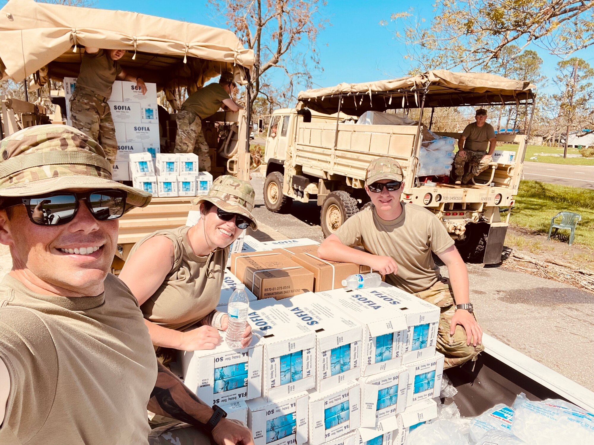 Oklahoma Air National Guard Staff Sgt. Macey Winegarner (center) helps distribute water to residents affected by Hurricane Ida in Louisiana, Sept. 09, 2021. (Photo Courtesy Staff Sgt. of Macey Winegarner)