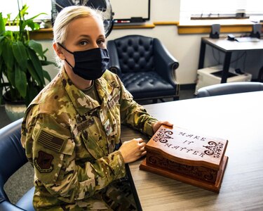 U.S. Air Force Col. Michele Lo Bianco, 305th Air Mobility Wing Operations commander, displays her box of remembrance. According to the National Institute of Mental Health, nearly one in five U.S. adults live with a mental illness. More than 1.7 million Veterans received treatment in a VA mental health specialty program annually.