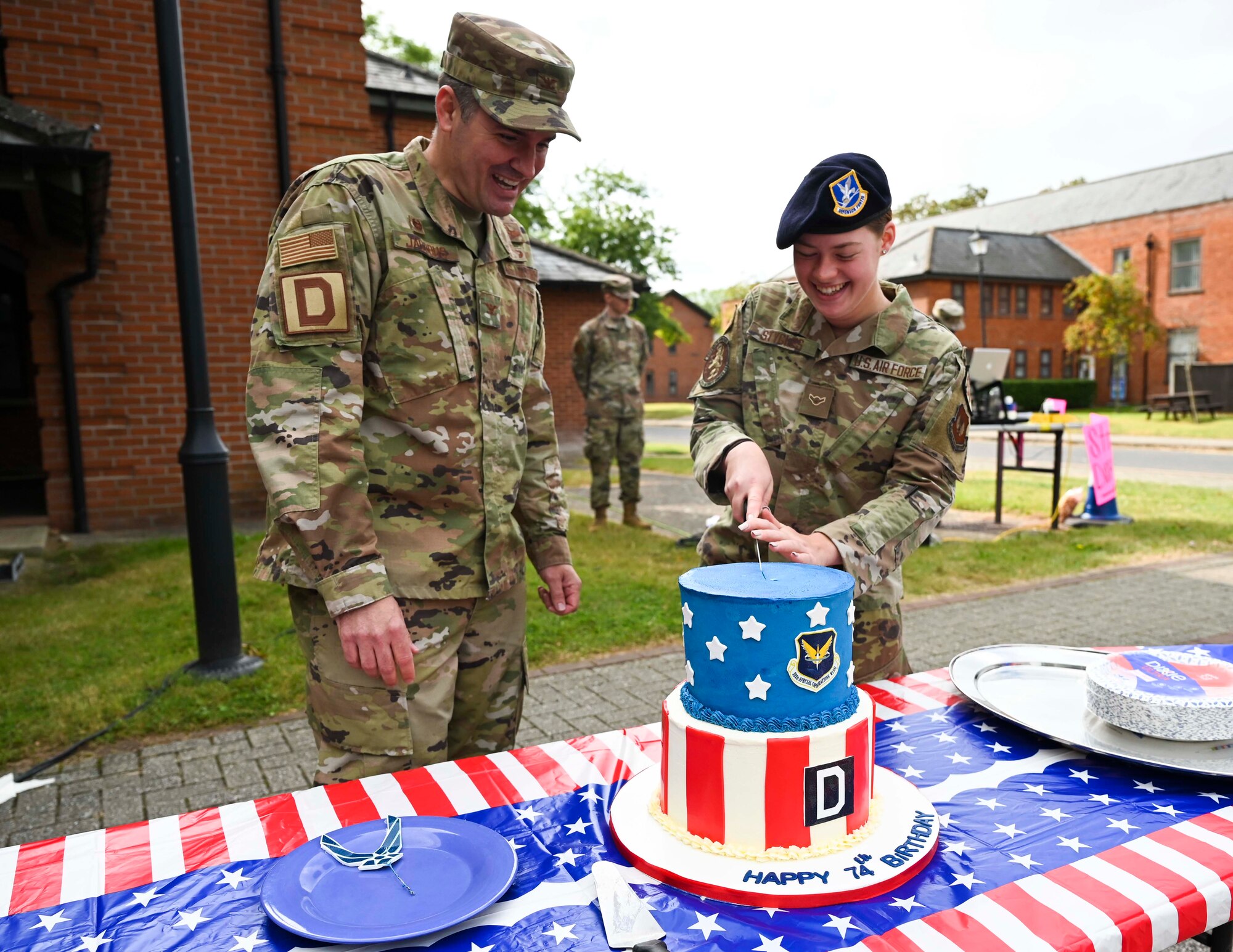 U.S. Air Force Col. Gene Jacobus and U.S. Airman Rhiana Stygles cut the 74th Air Force Royal Air Force, Mildenhall, United Kingdom, Sept. 17th, 2021.