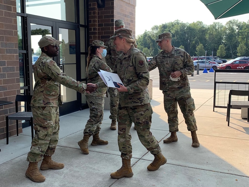 Pennsylvania Air National Guardsmen Tech Sgt. Rafeeq Strickland, a unit religious affairs Airman for the 111th Attack Wing, and Airman 1st Class Mackenzie O. Ditolla, a public health technician with the 111th Medical Group, were are among those congratulated by Col. Rebecca Gray, 111th ATKW Vice Commander, and Chief Master Sgt. Robert Fergusson, 111th ATKW Command Chief, for supporting Operation Allies Refuge at Joint Base McGuire Dix Lakehurst, New Jersey, Sept. 14, 2021.