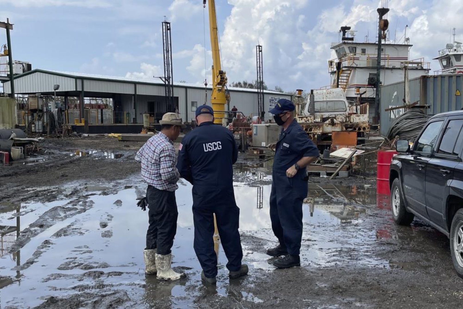 Chief Warrant Officer Morris and Chief Warrant Officer Parrington conduct damage assessment and casualty interviews Sept. 7, 2021, at Toms Marine and Salvage Yard in Lafitte, Louisiana. The Coast Guard continues to assess damage and environmental threats across Southeast Louisiana post Hurricane Ida. (U.S. Coast Guard photo)