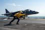 ARABIAN GULF (September 19, 2021) Aviation Boatswain’s Mate (Handling) 1st Class Martre Gober signals to an AV-8B Harrier attached to Marine Attack Squadron (VMA) 214 lands on the flight deck of the amphibious assault ship USS Essex, Sept. 19. Essex and the 11th Marine Expeditionary Unit are deployed to the U.S. 5th Fleet area of operations in support of naval operations to ensure maritime stability and security in the Central Region, connecting the Mediterranean and the Pacific through the western Indian Ocean and three strategic choke points. (U.S. Navy photo by Mass Communication Specialist 3rd Class Isaak Martinez)