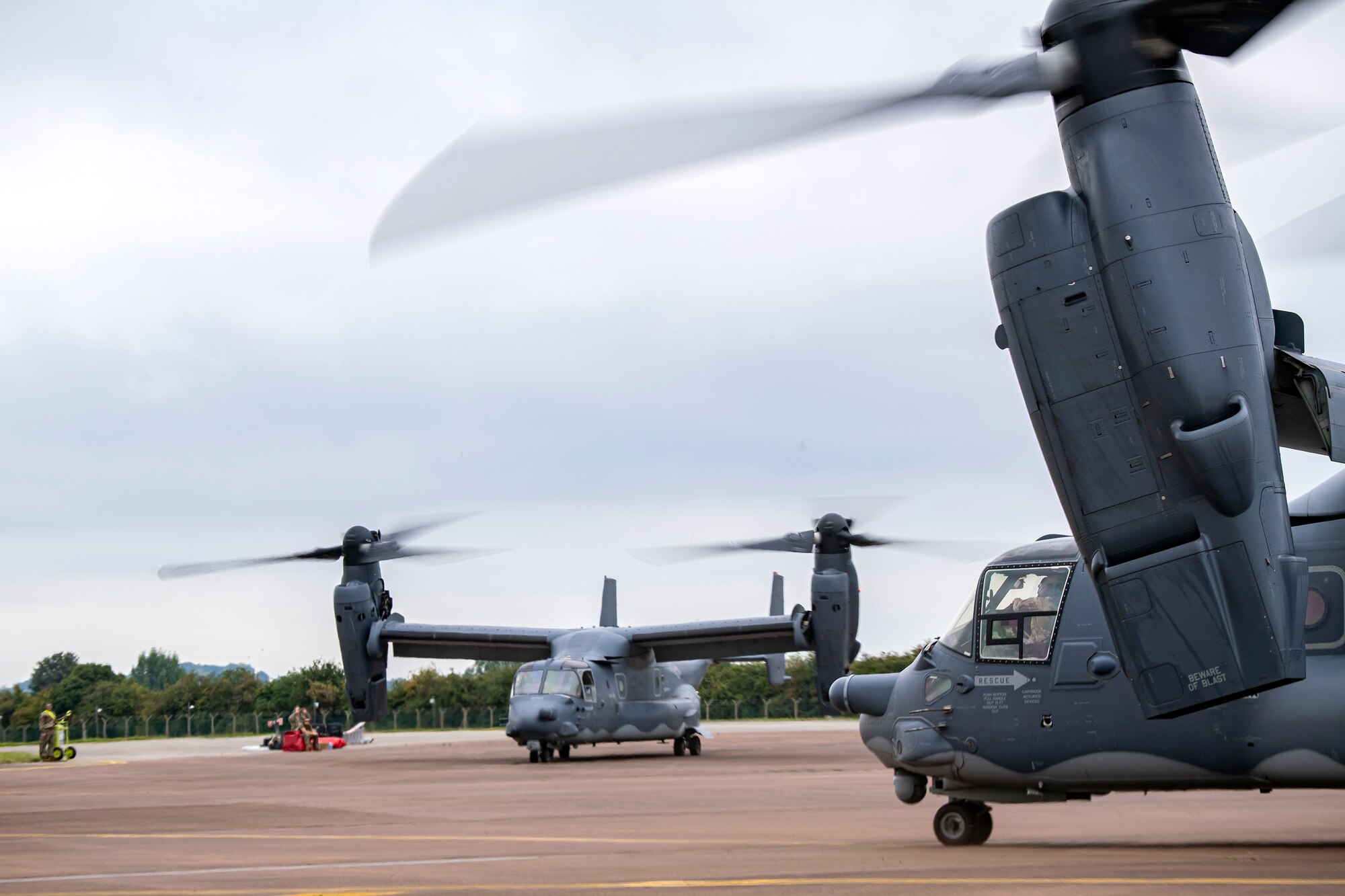 Two CV-22A Ospreys assigned to the 352d Special Operations Wing prepare to take off during an Agile Combat Employment exercise at RAF Fairford, England, Sept. 13, 2021. The exercise enables U.S. forces in Europe to operate from locations with varying levels of capacity and support. This further ensures Airmen and aircrews are postured to deliver lethal combat power across the full spectrum of military operations.(U.S. Air Force photo by Senior Airman Eugene Oliver)