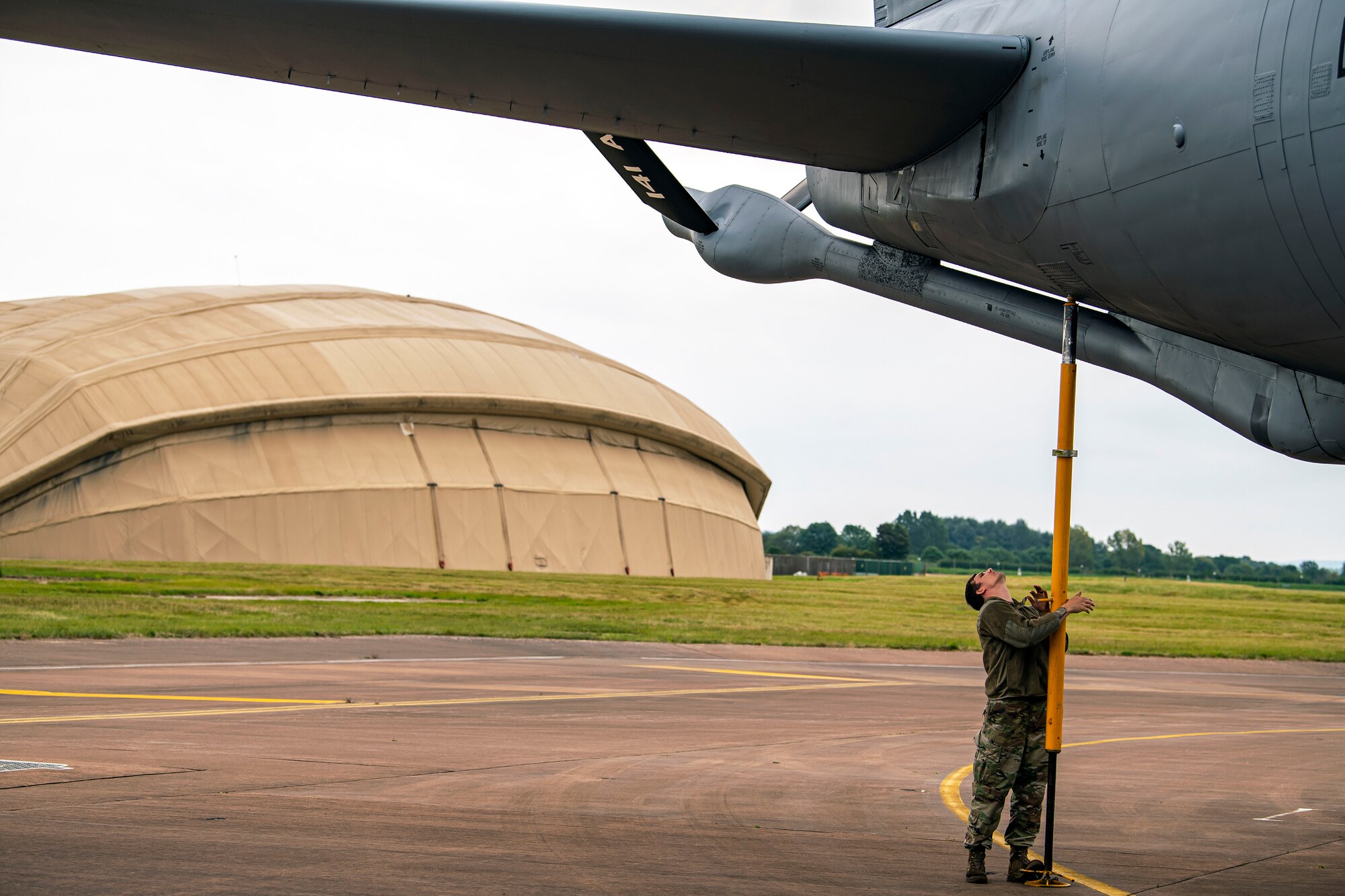 U.S. Air Force Tech. Sgt. Cody Goodin, 100th Aircraft Maintenance Squadron flying crew chief, secures a KC-135 Stratotanker during an Agile Combat Employment exercise at RAF Fairford, England, Sept. 13, 2021. The exercise enables U.S. forces in Europe to operate from locations with varying levels of capacity and support. This further ensures Airmen and aircrews are postured to deliver lethal combat power across the full spectrum of military operations. (U.S. Air Force photo by Senior Airman Eugene Oliver)