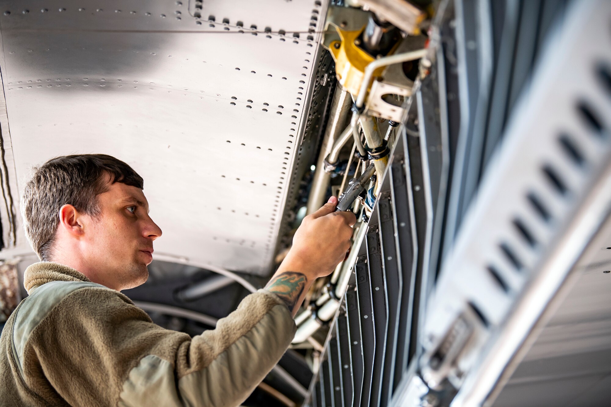 U.S. Air Force Tech. Sgt. Cody Goodin, 100th Aircraft Maintenance Squadron flying crew chief, performs maintenance on the wing of a KC-135 Stratotanker during an Agile Combat Employment exercise at RAF Fairford, England, Sept. 13, 2021. Airmen from the 501st Combat Support Wing, 100th Air Refueling Wing and 352d Special Operations Wing partnered to conduct an ACE exercise to test their overall readiness and lethality capabilities. The exercise enables U.S. forces in Europe to operate from locations with varying levels of capacity and support. (U.S. Air Force photo by Senior Airman Eugene Oliver)