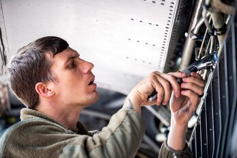 U.S. Air Force Tech. Sgt. Cody Goodin, 100th Aircraft Maintenance Squadron flying crew chief, performs maintenance on the wing of a KC-135 Stratotanker during an Agile Combat Employment exercise at RAF Fairford, England, Sept. 13, 2021. Airmen from the 501st Combat Support Wing, 100th Air Refueling Wing and 352d Special Operations Wing partnered to conduct an ACE exercise to test their overall readiness and lethality capabilities. The exercise enables U.S. forces in Europe to operate from locations with varying levels of capacity and support. (U.S. Air Force photo by Senior Airman Eugene Oliver)