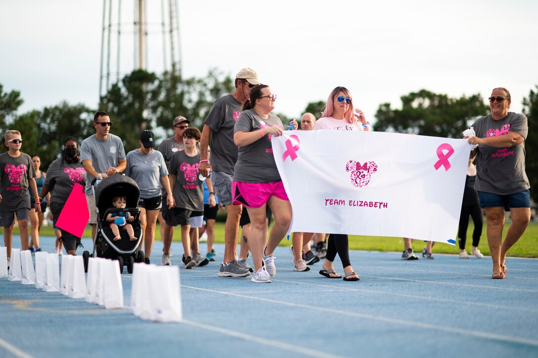 Photo of a group of people walking around a track