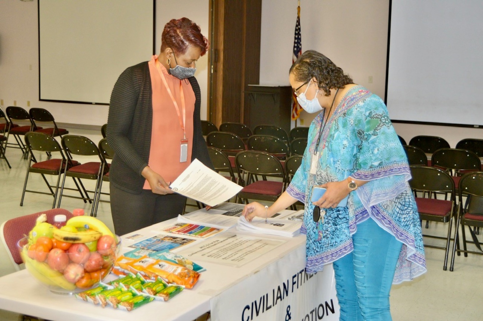 Luewana Hannon (left), community ready and resilient integrator, provides information to Georgia Louis (right) during the education and information fair at the Join Readiness Training Center and Fort Polk Army Community Service, Sept. 20.