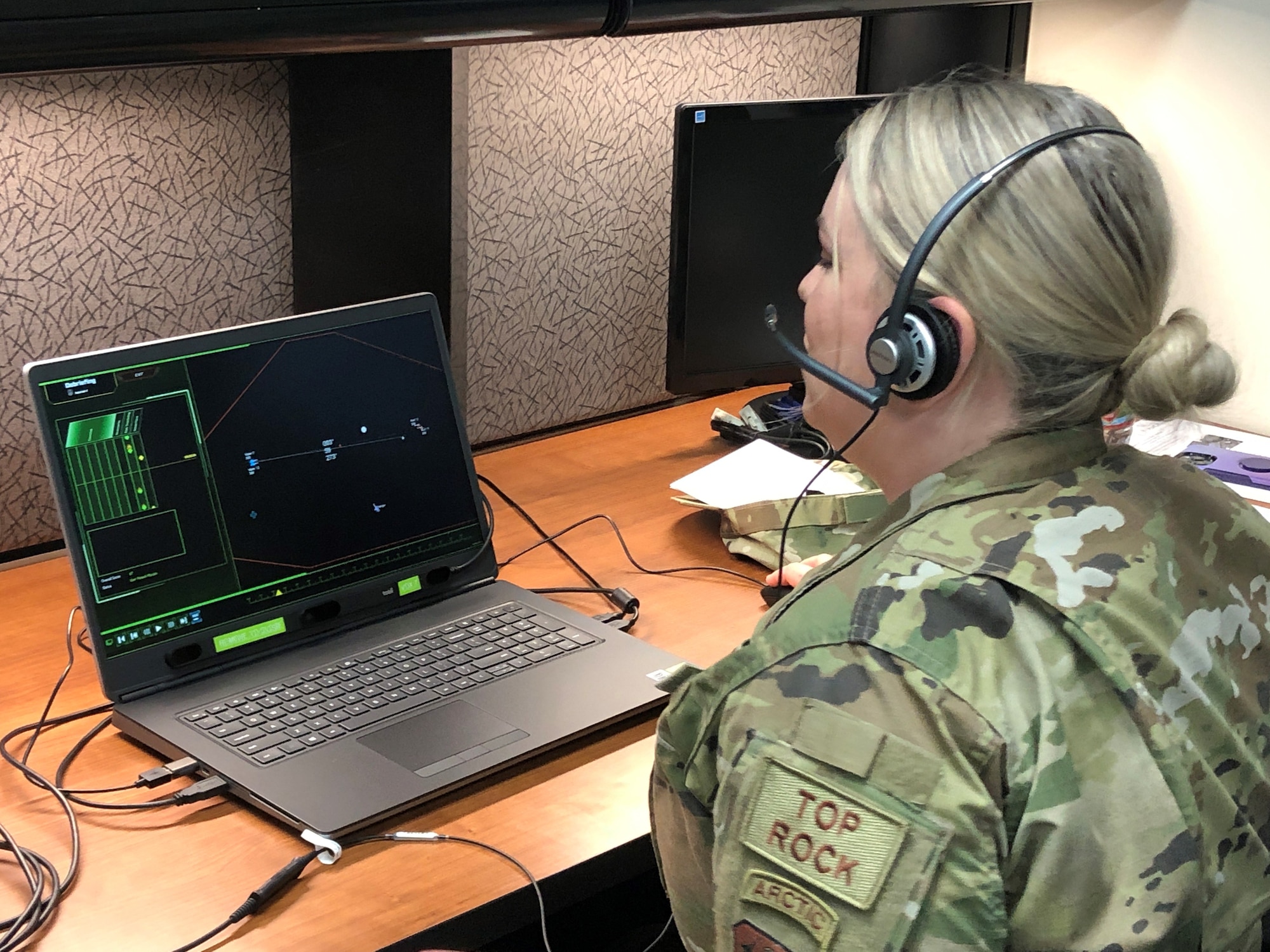 Airman working on a computer