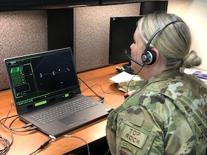 Airman working on a computer