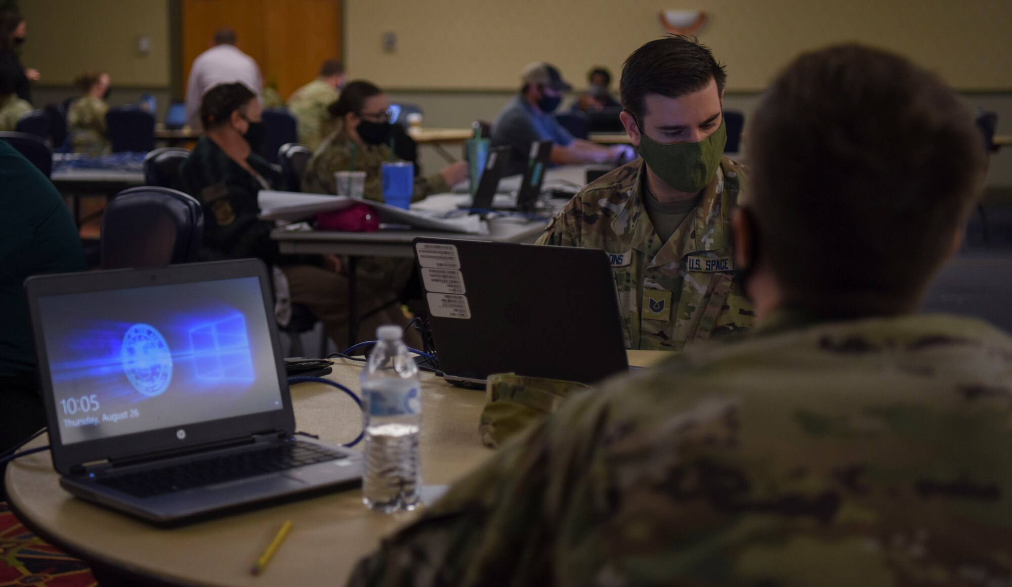 Airmen and Guardians work on coding their bots that they will present to the group at the end of the day.