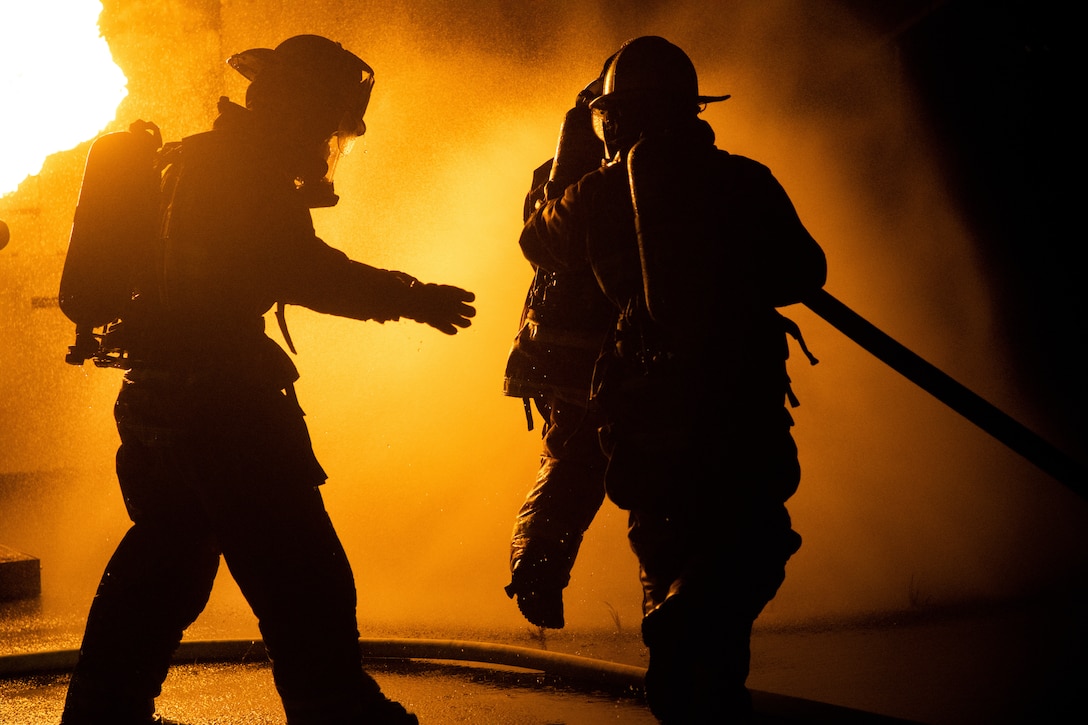 U.S. Marines with Marine Corps Air Facility Quantico execute fire and rescue training at the airfield on Marine Corps Base Quantico, Va., Sept.1, 2021. They practiced how to control a fuel fire on a simulated downed aircraft to prepare for any real-life scenarios. MCAF implements quarterly training for Marines to improve mission capabilities for the base.