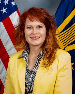 An eagle perched on an American flag shield over a blue background of 13 stars enwreathed in a gold ribbon with the words Defense Logistics Agency