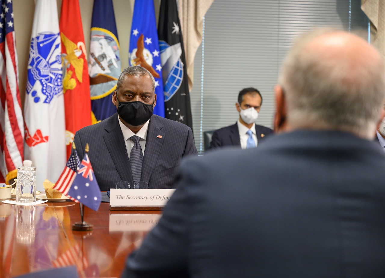 Men sit at a conference table.