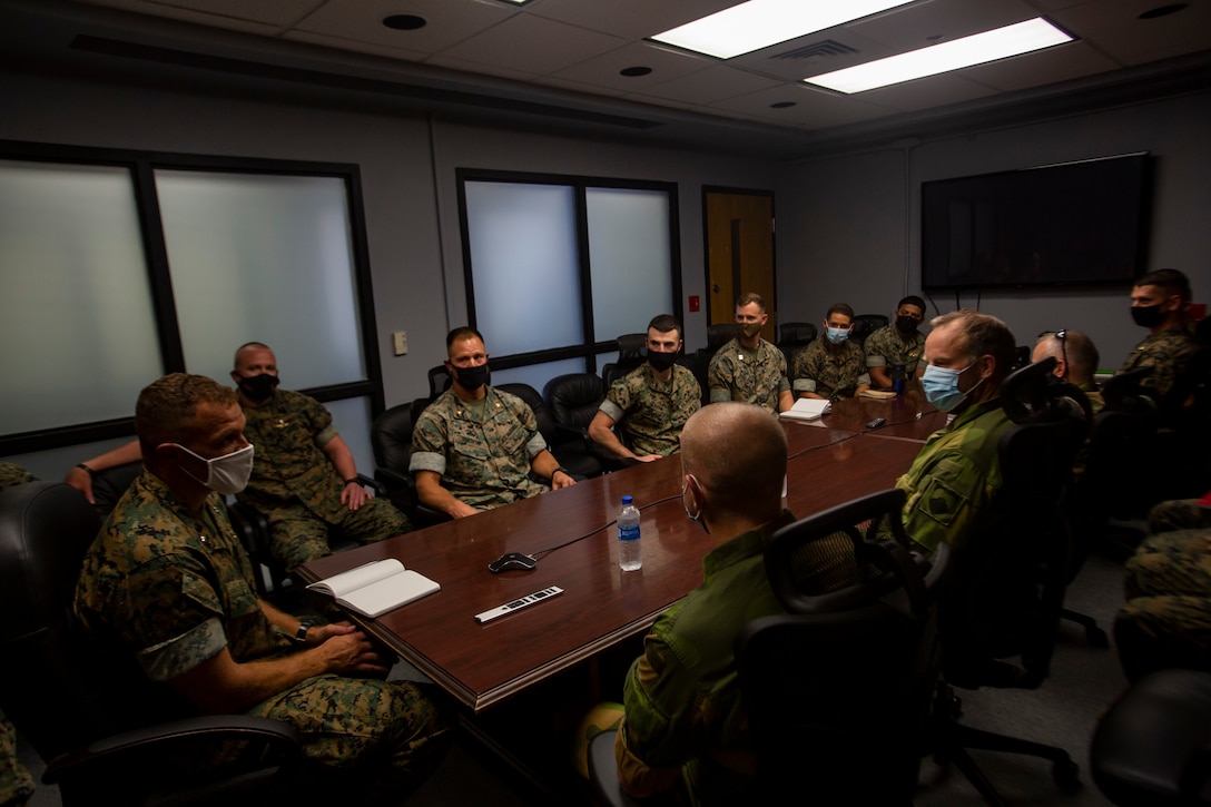 Members of the Norwegian Military Intelligence Battalion, Norwegian Army, are briefed by U.S. Marine Corps Lt. Col. Eric Tee, battalion commander, 2nd Reconnaissance Battalion, and his staff during a visit aboard Marine Corps Base Camp Lejeune, N.C., Sept. 15, 2021. II Marine Expeditionary Force intelligence commanders welcomed their counterparts with a tour of facilities and workspaces showcasing their capabilities. II MEF hosts also briefed on intelligence integration, mission accomplishment, and strengthening partnerships amongst the individual units.