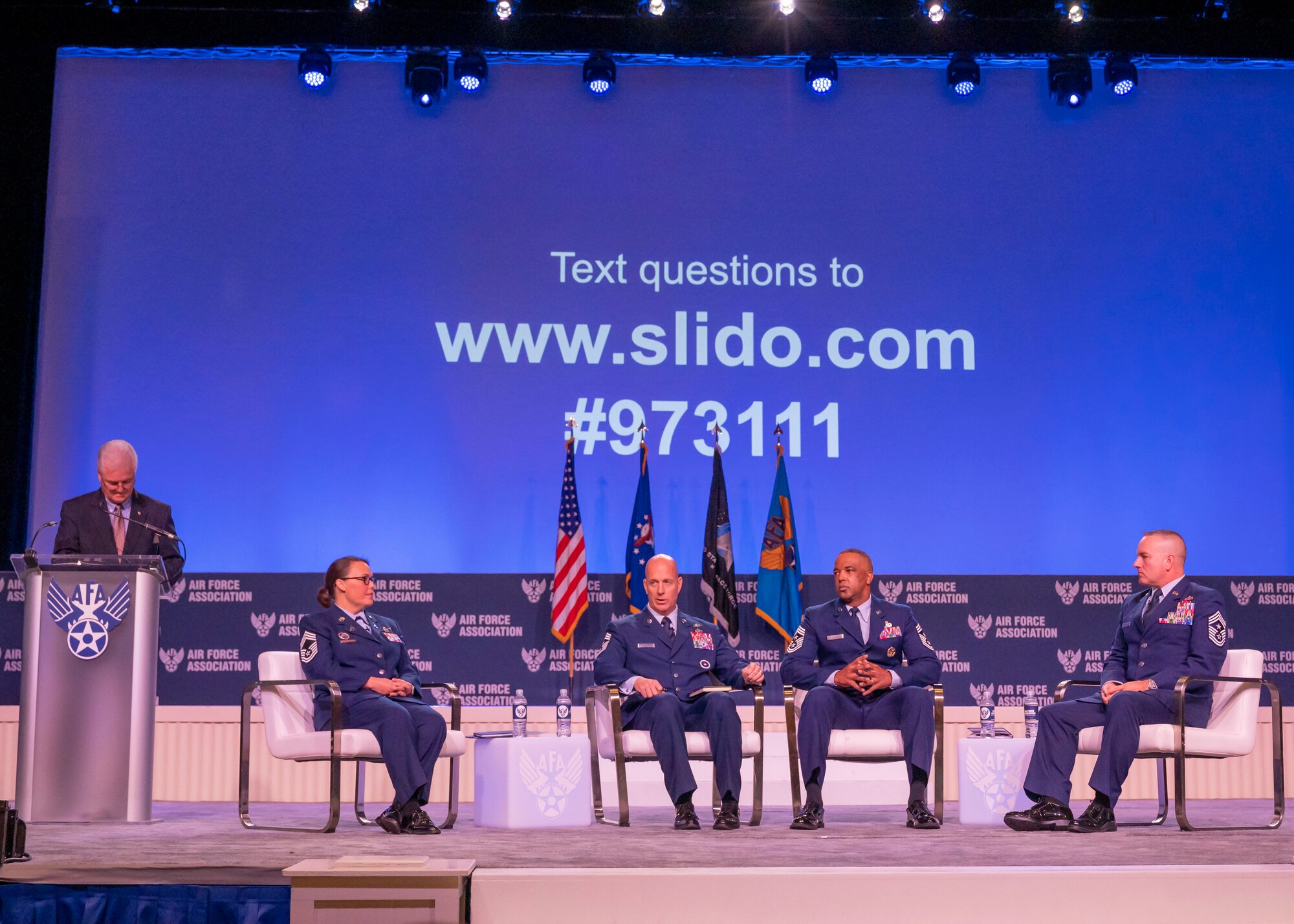 Photo of chief master sergeants speaking during a conference