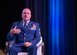 Photo of a chief master sergeant speaking on a stage