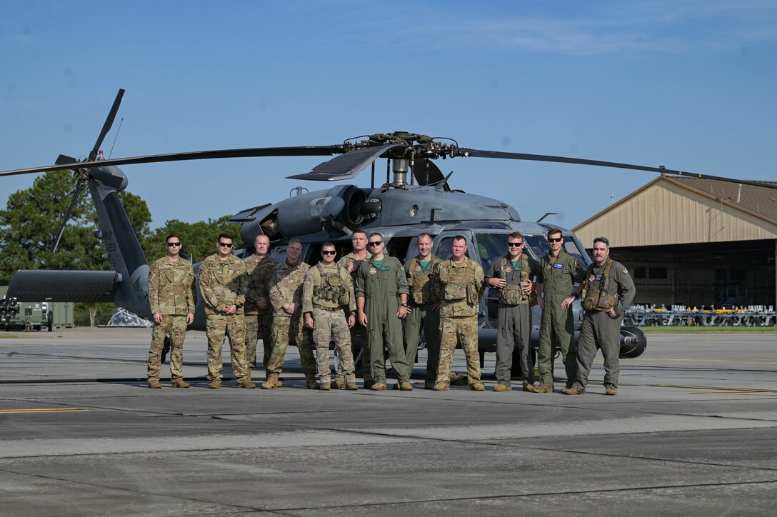 men in front of helicopter