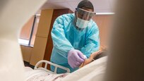 U.S. Air Force 1st Lt. Kayon Dickens, a registered nurse assigned to 81st Medical Group out of Keesler Air Force Base, Mississippi, checks a patient’s oxygen tube at Our Lady of the Lake Regional Medical Center in Baton Rouge, Louisiana, Sept. 20, 2021. U.S. Northern Command, through U.S. Army North, remains committed to providing flexible Department of Defense support to the whole-of-government COVID response. (U.S. Army photo by Sgt. 1st Class Timothy Hughes)