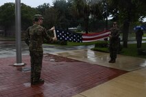 Honor Guard members fold the American flag during a retreat at Joint Base Charleston, South Carolina, Sept. 16, 2021. All over Joint Base Charleston, military personnel from different places and backgrounds came together in honor of prisoners of war and missing in action service members. Currently 83,000 service members unaccounted for. (U.S. Air Force photo by Airman 1st Class Jade Dubiel)