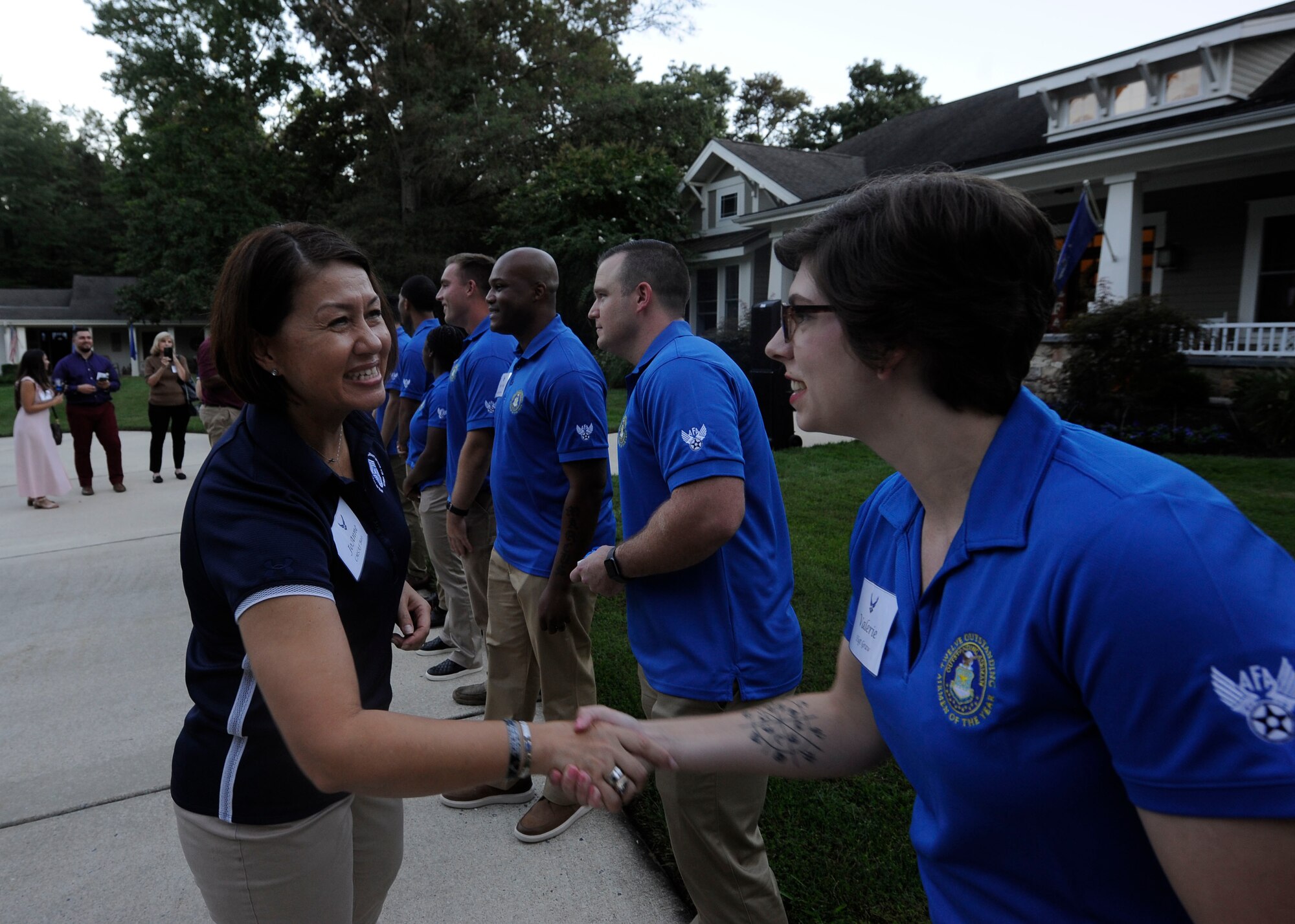 Chief Master Sgt. of the Air Force JoAnne S. Bass congratulates Staff Sgt. Valerie Graw, an 88th Communications Squadron cyber operations controller, during a social hour hosted for the 2021 12 Outstanding Airmen of the Year at Joint Base Andrews, Md., Sept. 19, 2021. Graw was recognized as one of the 2021 12 Outstanding Airmen of the Year based on superior leadership, job performance and personal achievement. (U.S. Air Force photo by Staff Sgt. Nicolas Z. Erwin)