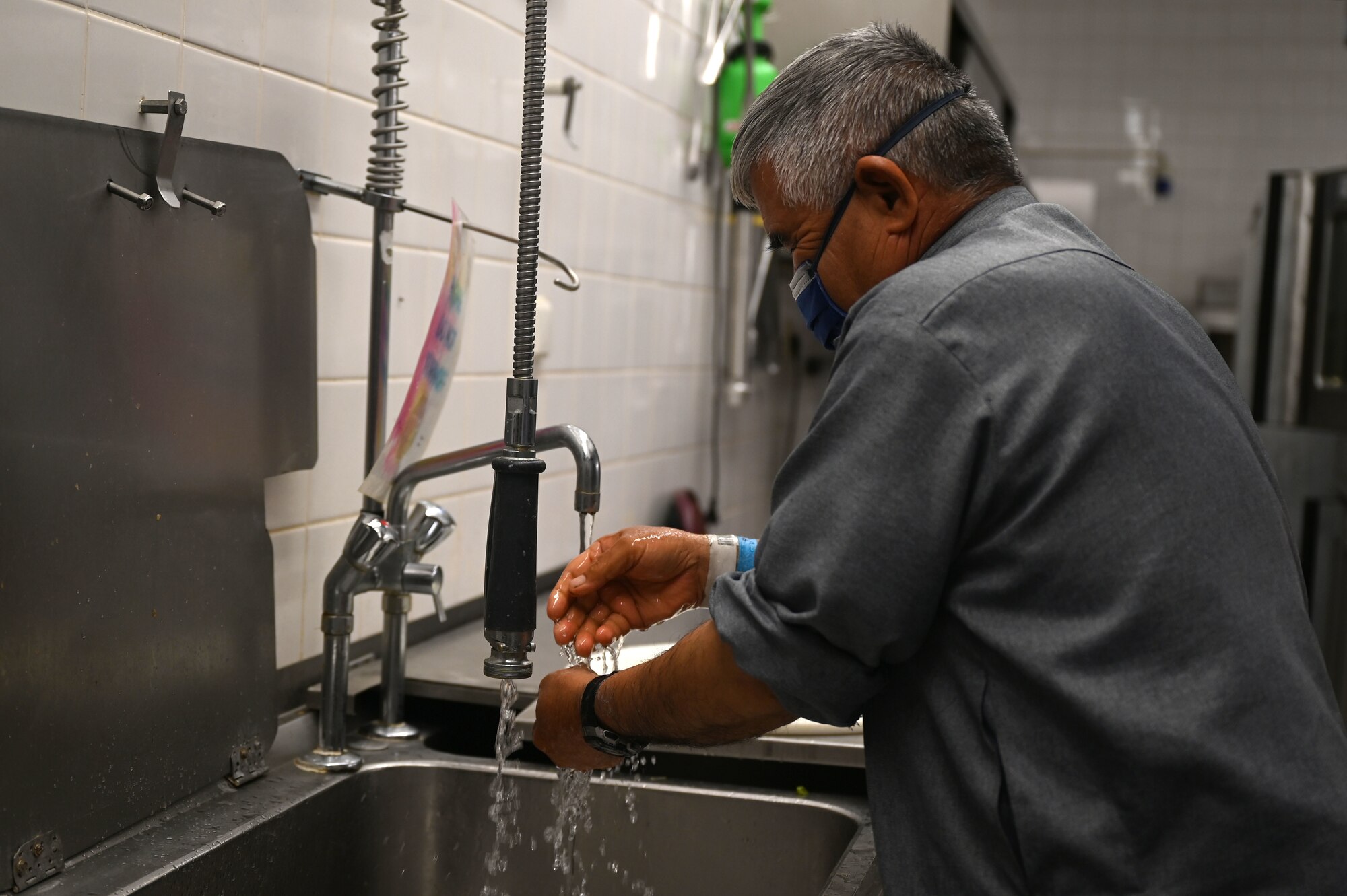 Evacuee washes their hands.