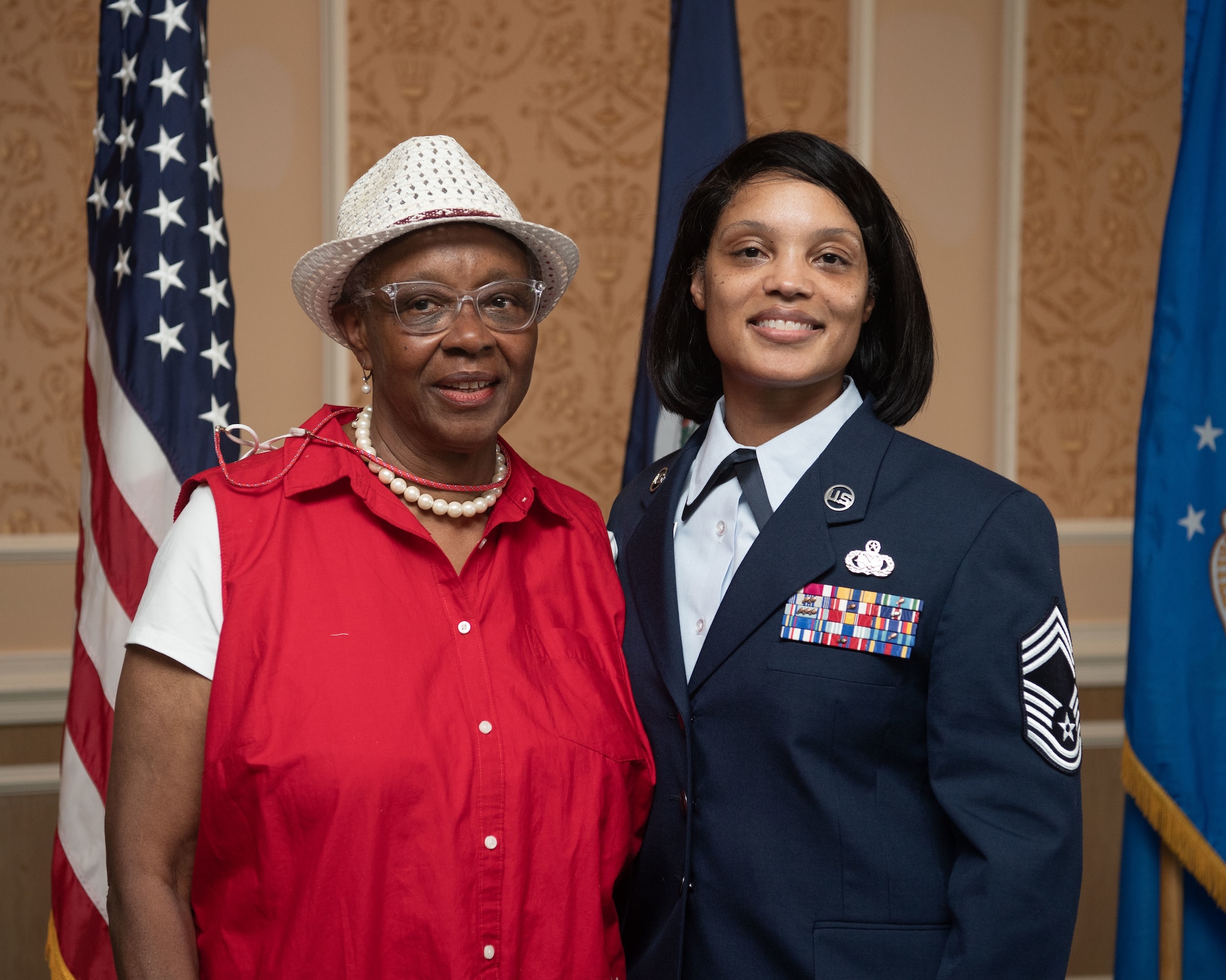 Retired Senior Master Sgt. Dorothy May Tatem and Chief Master Sgt. Lawanda Jackson, 192nd Support Squadron Mobility Flight chief, pose for a photo at Jackson's promotion ceremony on July 10, 20221, at Joint Base Langley-Eustis, Virginia. Tatem was the first Black woman to enlist into the VaANG and Jackson the first Black female to become chief master sergeant. (U.S. Air National Guard photo by Staff Sgt. Bryan Myhr)