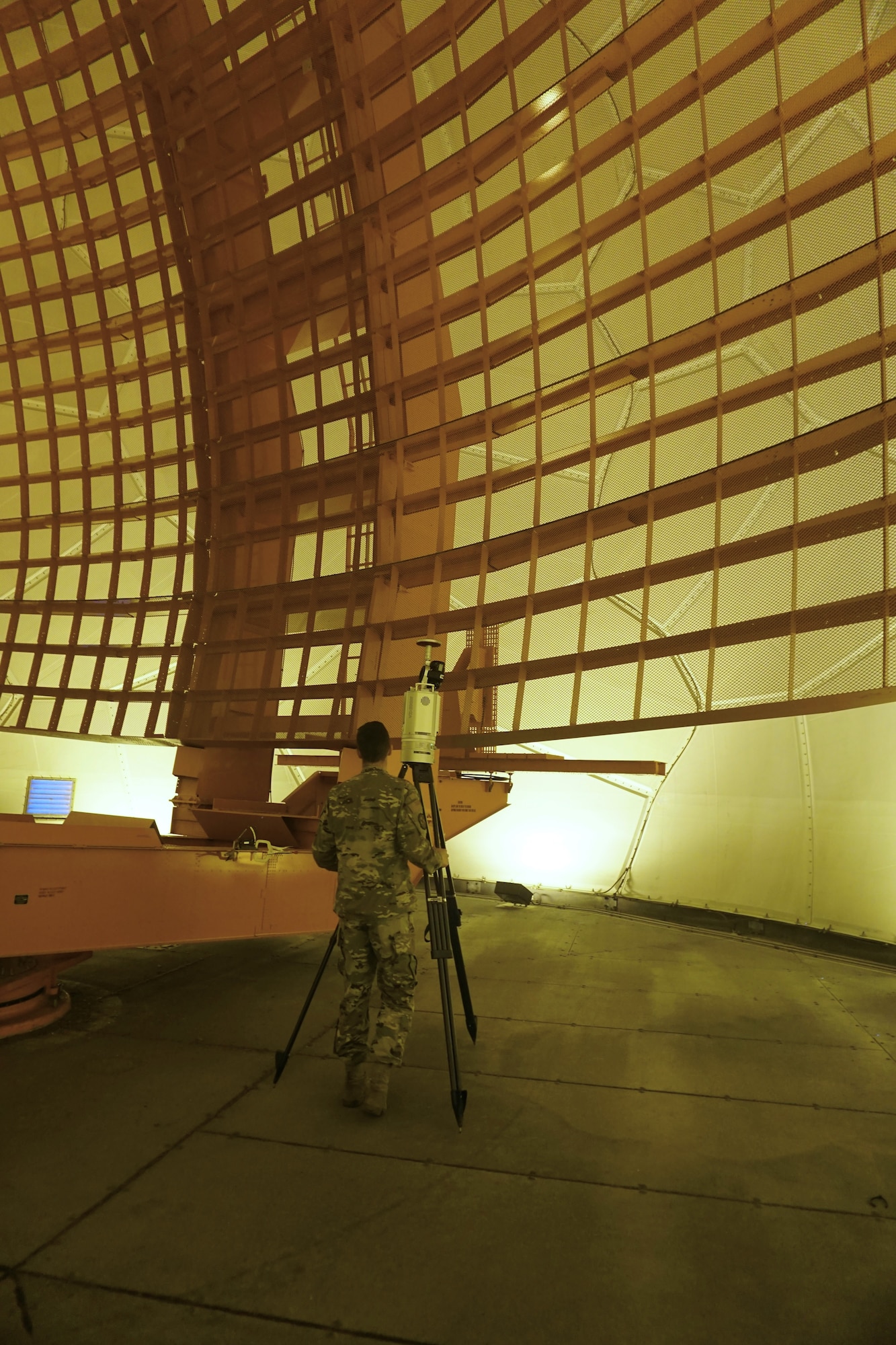 U.S. Airman standing in front of radar