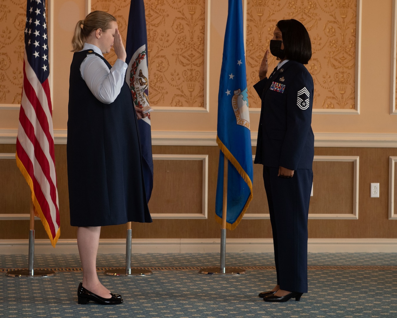 Maj. Erica Legg, 192nd Support Squadron director of operations, performs the Oath of Enlistment for Chief Master Sgt. Lawanda Jackson, 192nd SS Mobility Flight chief, during her promotion ceremony on July 10, 2021, at Joint Base Langley-Eustis, Virginia. When an Airman is promoted to chief, it is tradition to perform the Oath of Enlistment. (U.S. Air National Guard photo by Staff Sgt. Bryan Myhr)